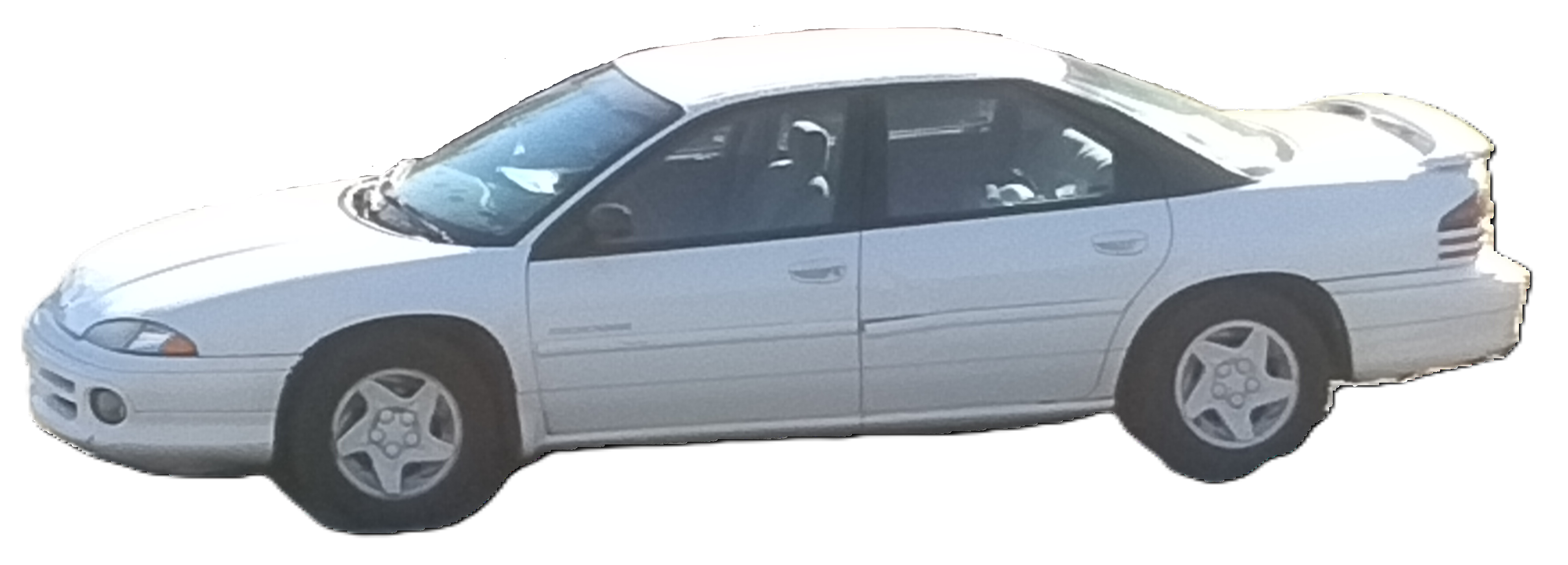 Far side angle photo of Mystique, a white 1996 Dodge Intrepid, bathing in the sunlight